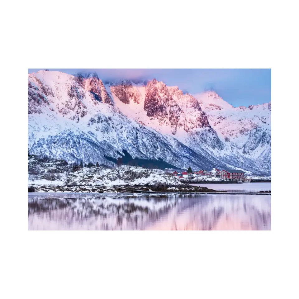 Beautiful winter lake and snowy mountains at sunset