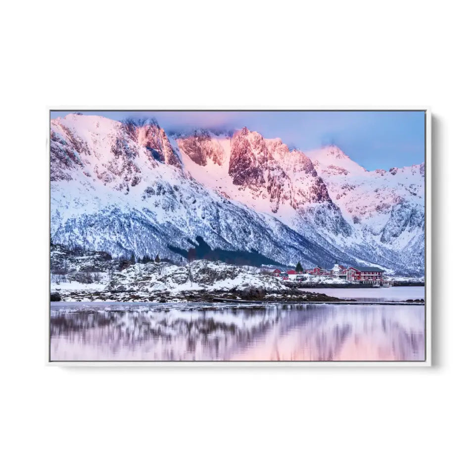 Beautiful winter lake and snowy mountains at sunset