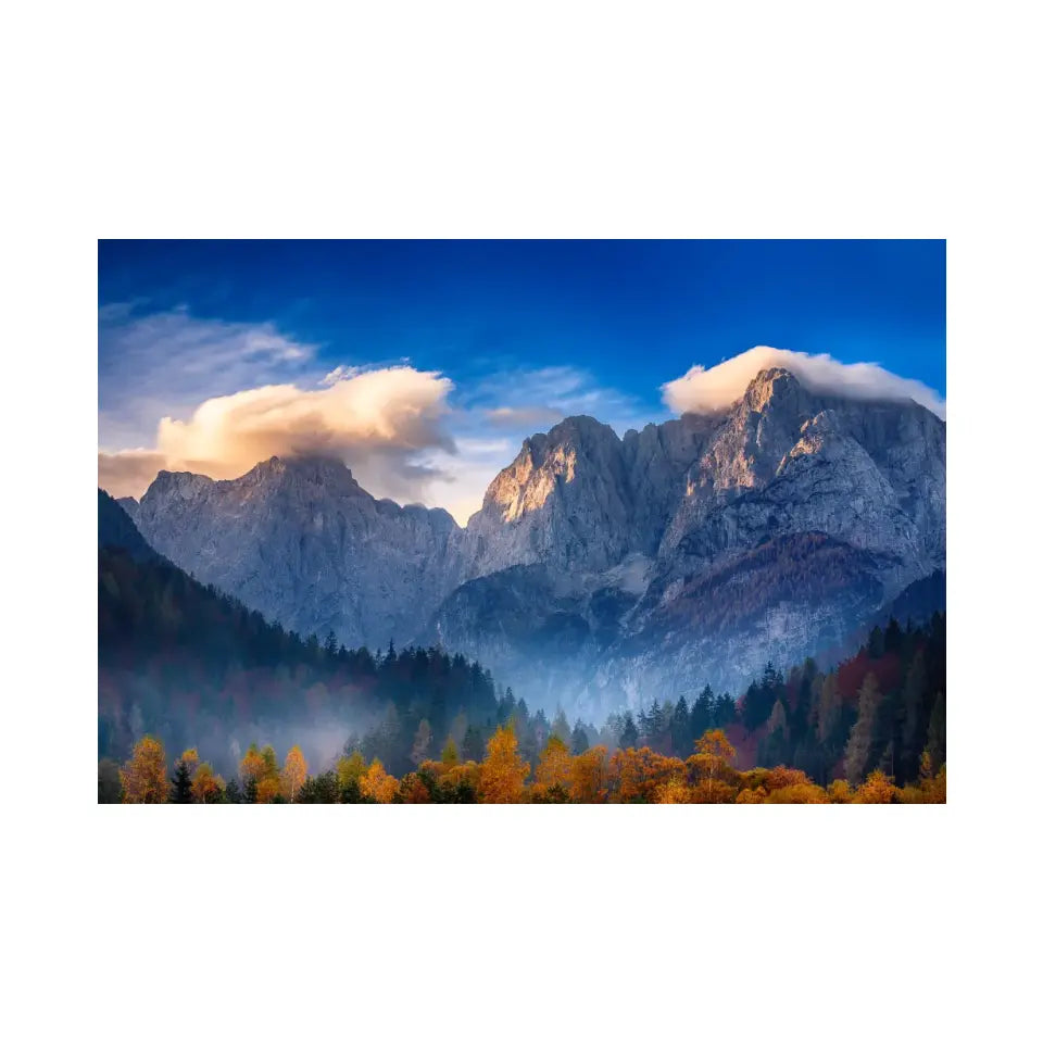 Triglav mountain peak at sunrise with beautiful clouds in morning light