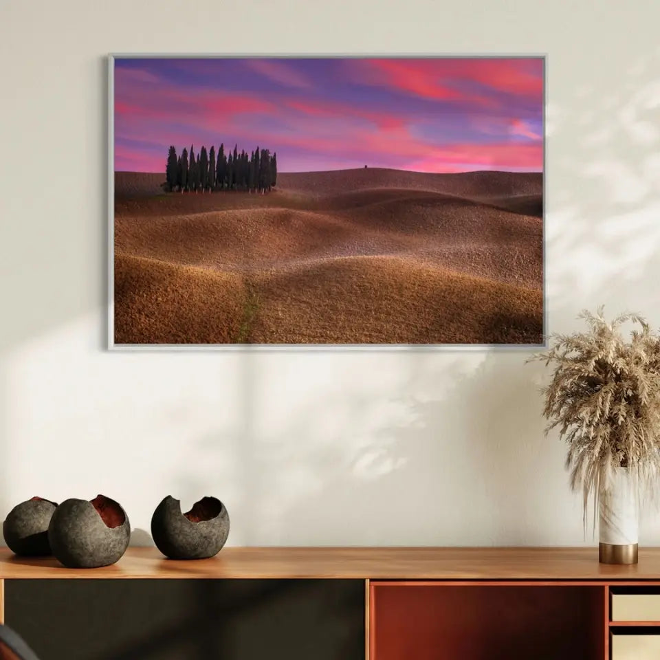 Tuscany landscape with cypress and earth waves at sunset