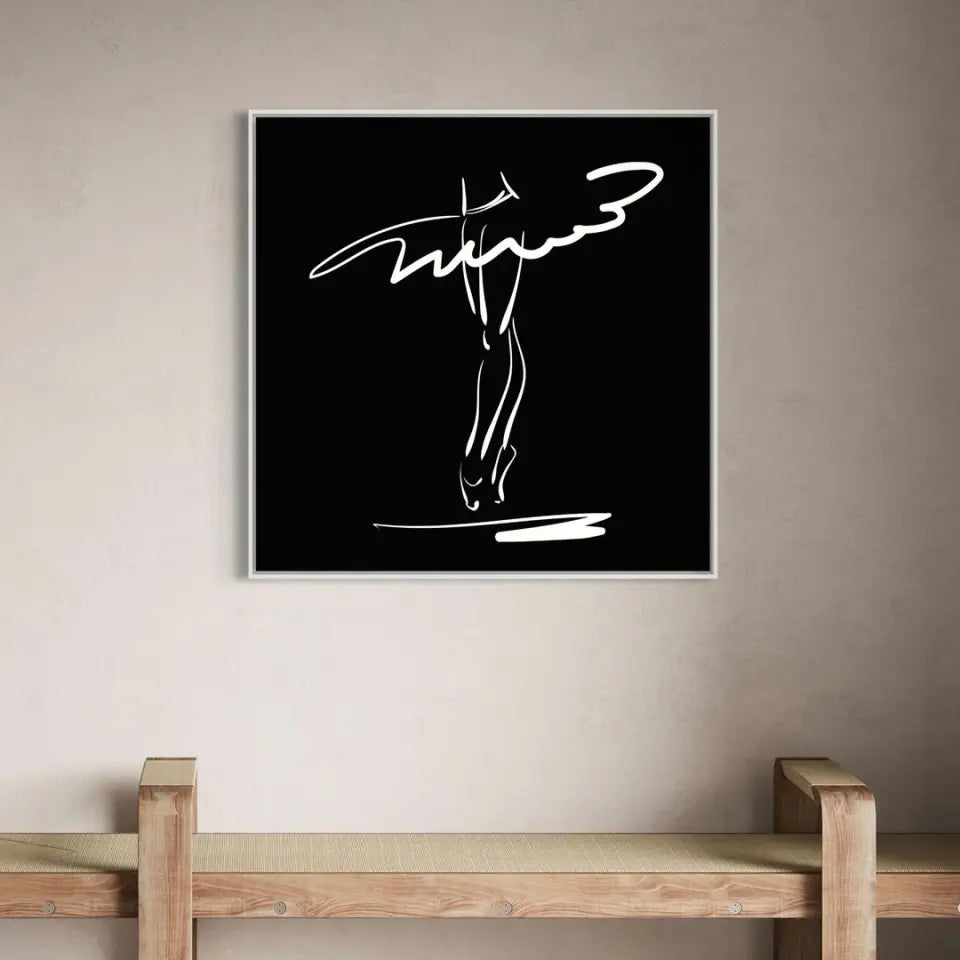 Legs of a ballerina in a classical pose, white on black #B28